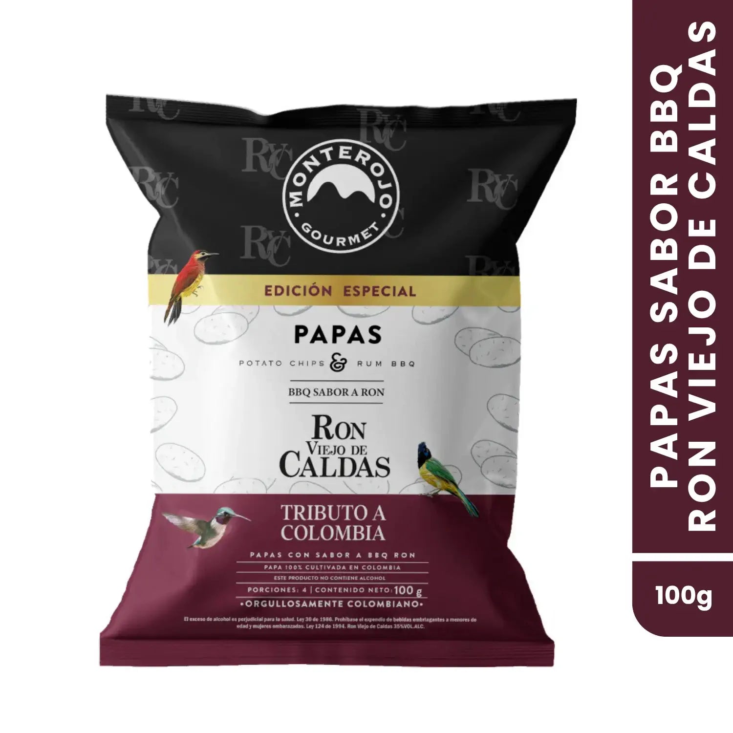 Empaque frontal de papas chips Monte Rojo, edición especial sabor Ron Viejo de Caldas de 100g. El diseño incluye ilustraciones de aves típicas colombianas sobre un fondo de tonos negro, crema y vinotinto, destacando la colaboración "Tributo a Colombia" y el logo de la marca.